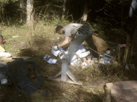 DNR Officer Jason Bodine seeking evidence to identify Person who illegally dumped trash in Capitol State Forest, WA 